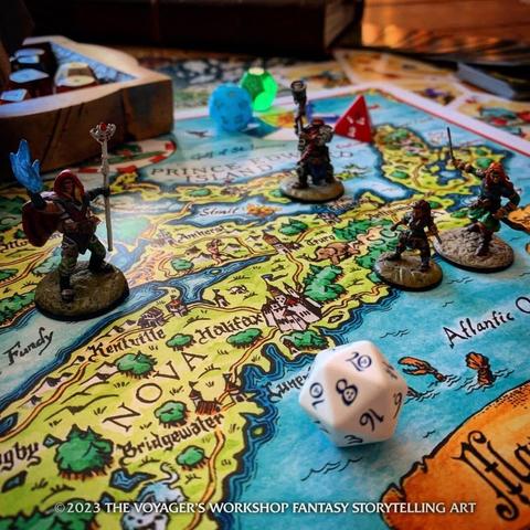 Closeup photo of a fantasy map of Nova Scotia covered with TTRPG dice and minis.