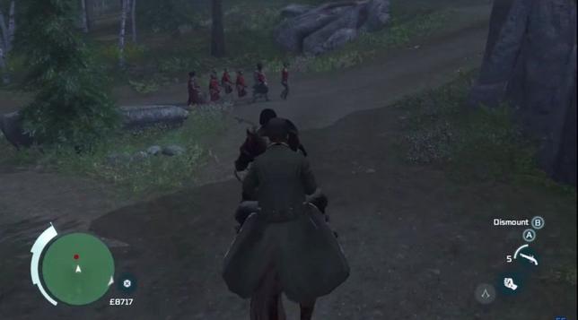 Two men on a horse, riding down a wooded path. Ahead of them are marching Redcoat British soldiers
