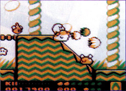 Prerelease still of KDL2 showing Kirby on Rick breathing fire near some Sparkies